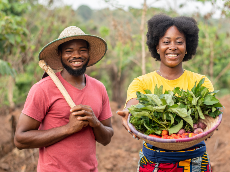 farmers smiling because of good planting and harvesting season